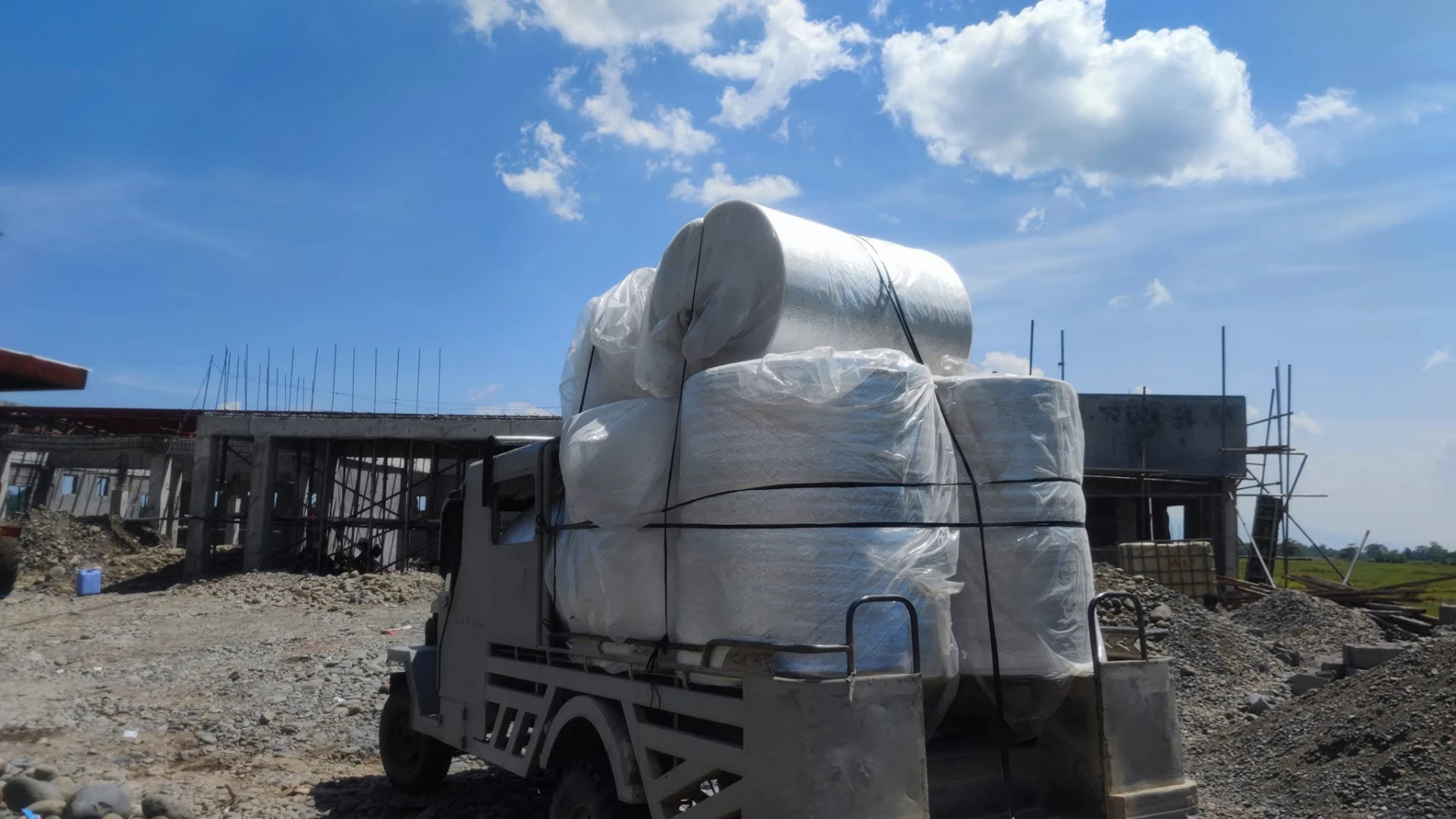 Truck loaded with wrapped building materials